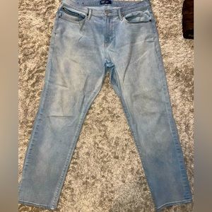 Men’s light wash denim jeans.